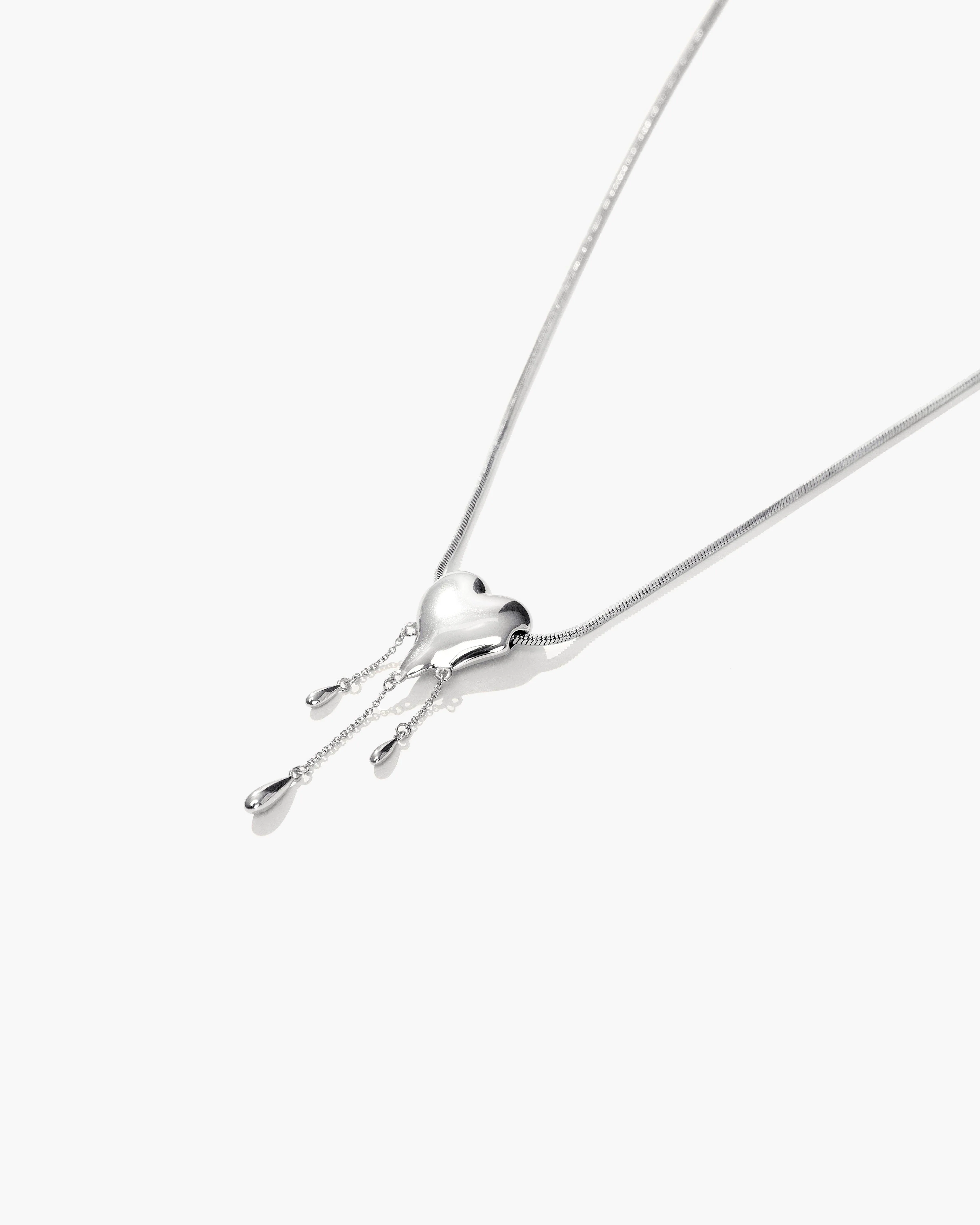 Venom’s Golden Drip Heart Necklace in Silver - Image 3